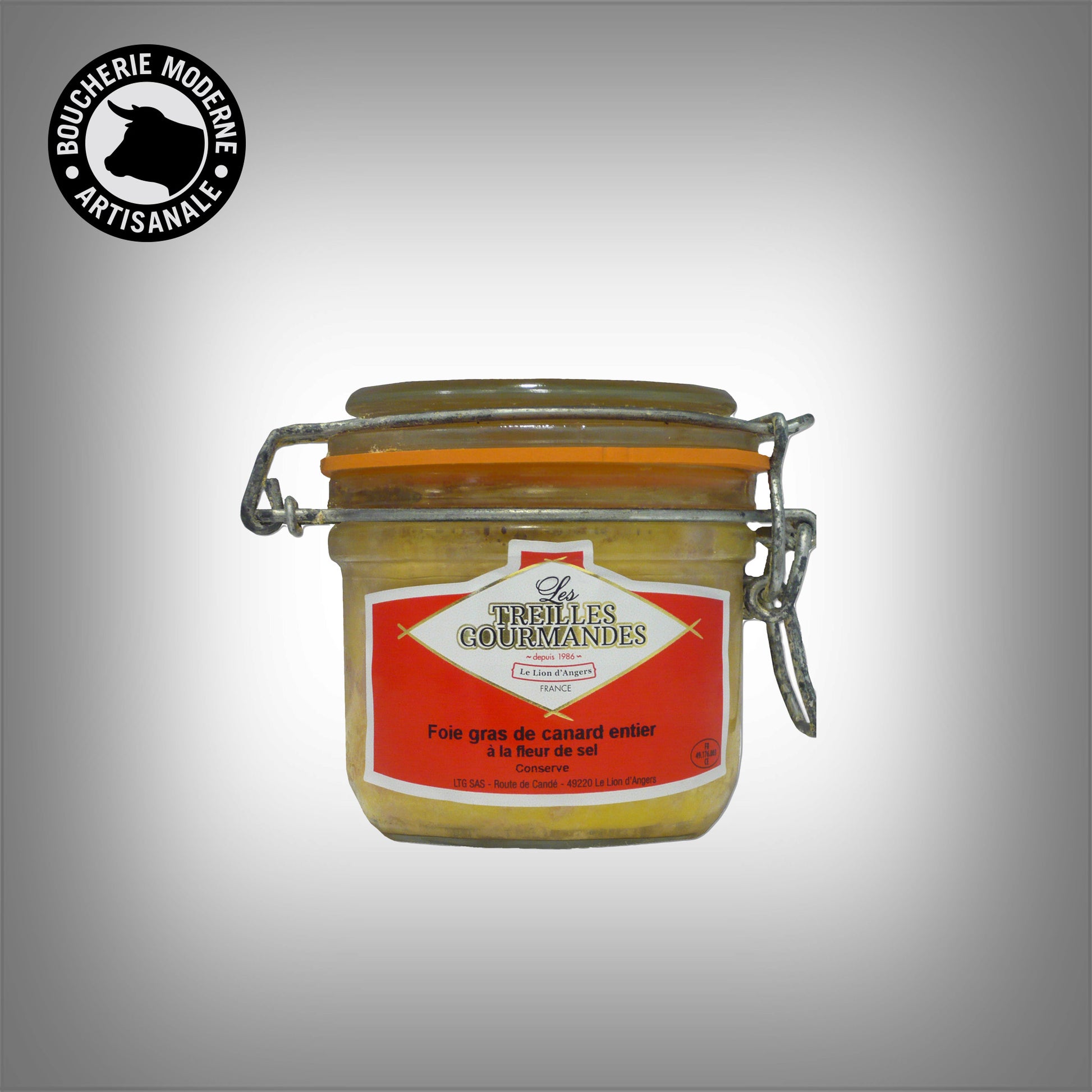 Foie gras de canard en conserve, fondant et savoureux, idéal pour les entrées et repas festifs.