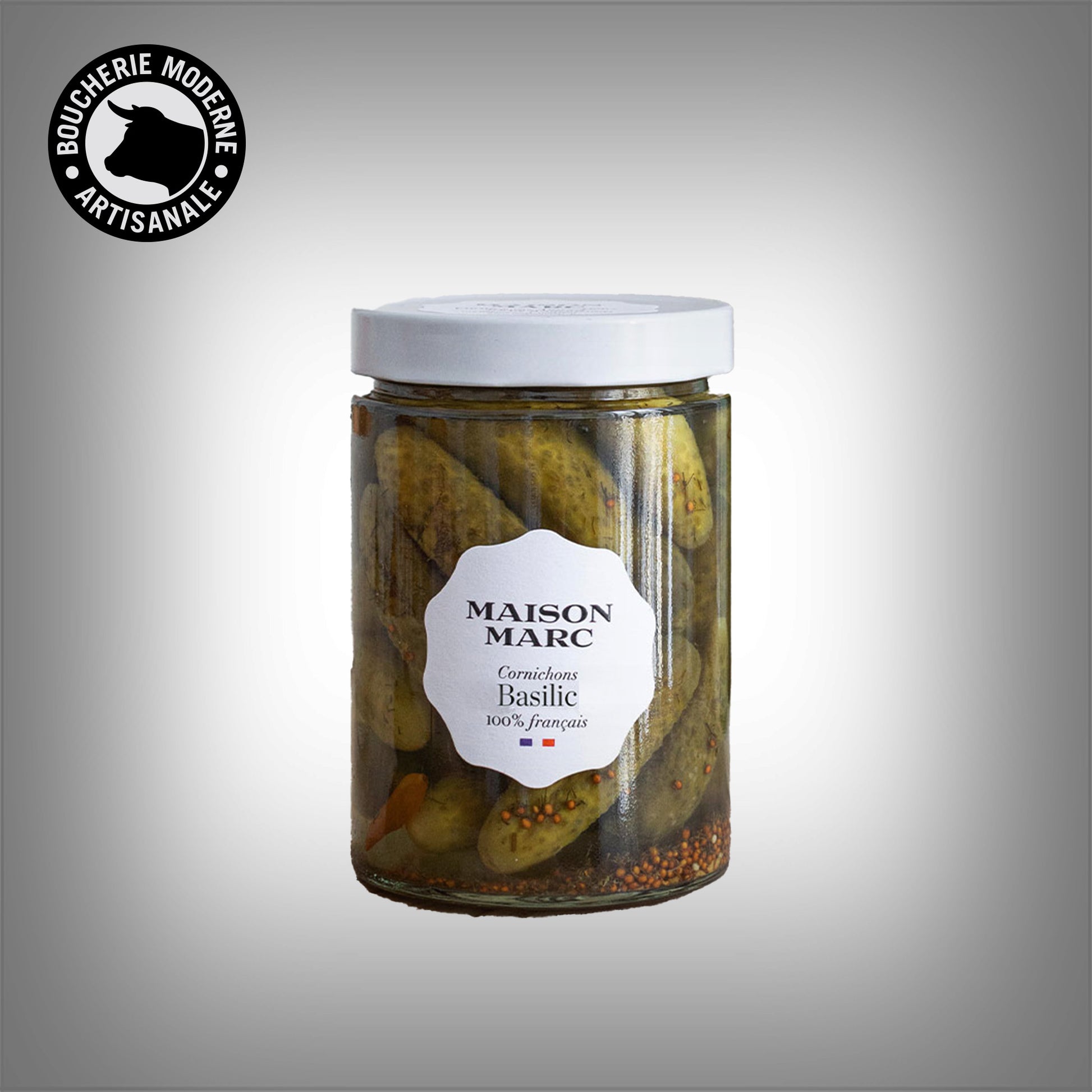 Cornichons Maison Marc au basilic, croquants et aromatiques, à la fraîcheur herbacée.