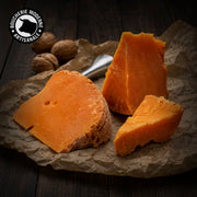 Mimolette française affiné 12 mois, texture ferme et arômes de noisette.
