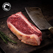 L-Bone Longhorn savoureuse et persillée, idéale pour une cuisson au grill.