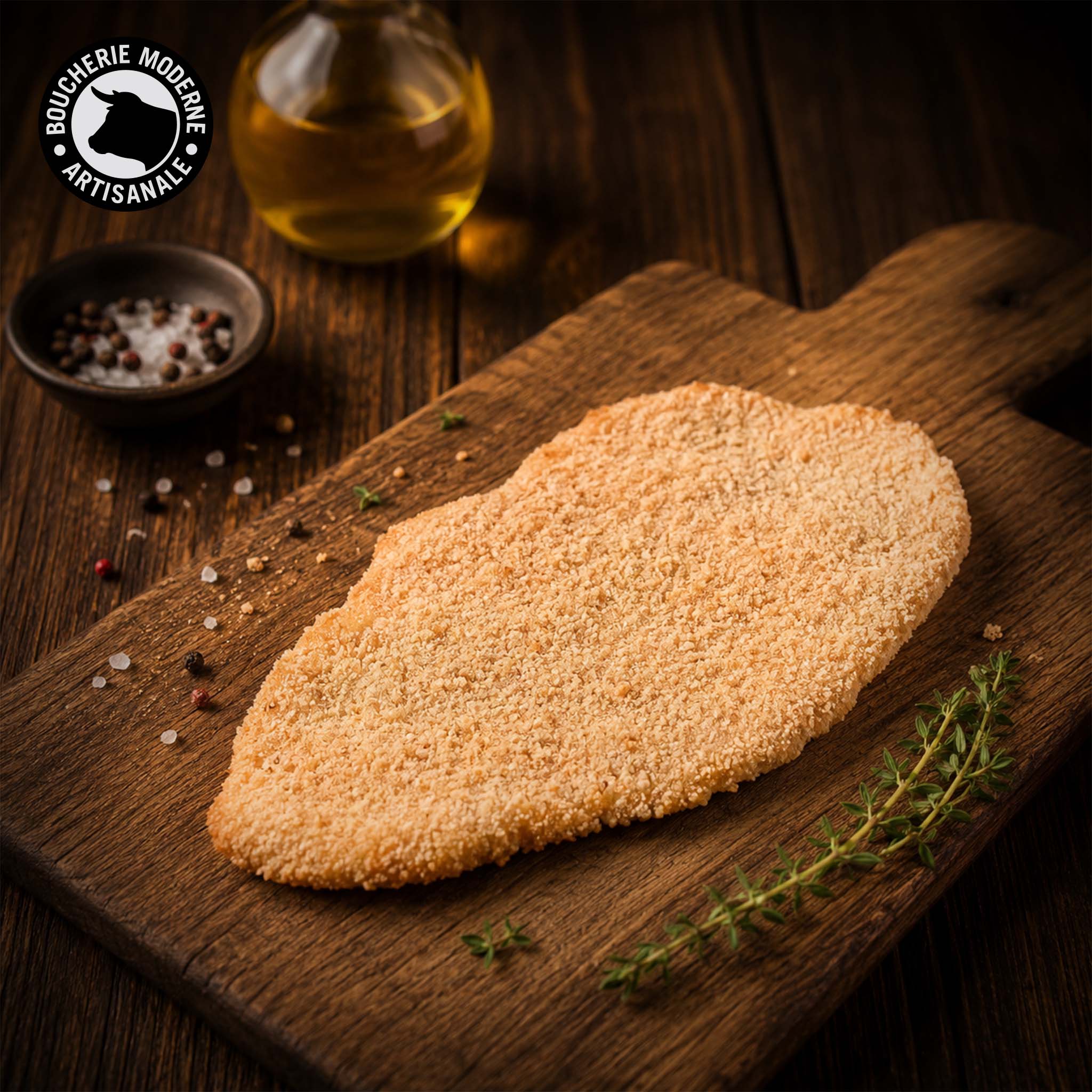 Escalope panée croustillante et moelleuse, prête à dorer à la poêle.